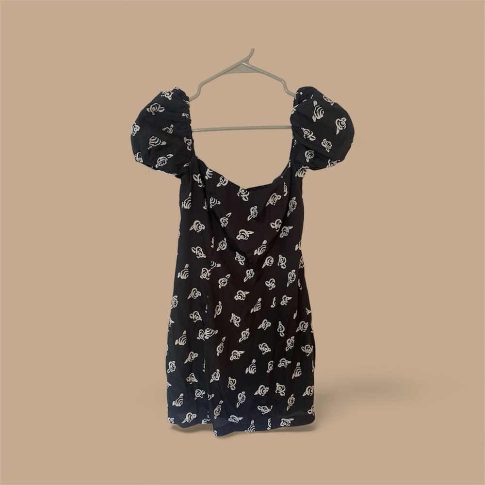 Likely Black Dress with White Floral Pattern